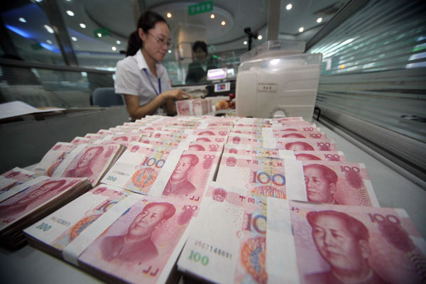 A clerk counts money at a bank in Ganyu, Jiangsu province. Yuan has appreciated 43 percent since a new exchange rate mechanism was implemented in 1994. SI WEI / FOR CHINA DAILY Yuan gains the most in 20 years vs US dollar