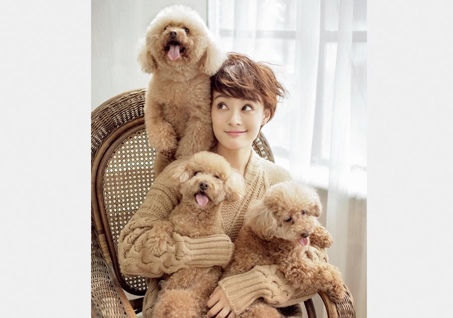 Sun Li poses with dogs for fashion magazine