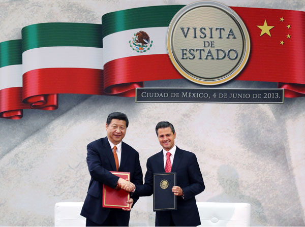 President Xi Jinping and his Mexican counterpart Enrique Pena Nieto celebrate after they signed a joint declaration in Mexico City on Tuesday. Photo by Yao Dawei / Xinhua China, Mexico boost relations