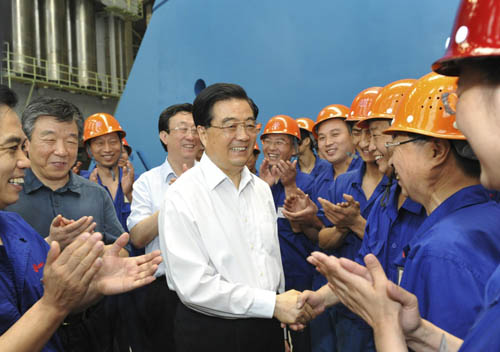 Hu urges economic restructuring, agricultural production