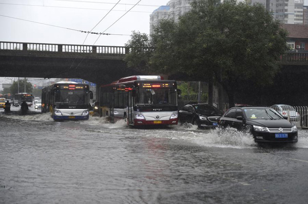 Beijing issues orange alert for heavy rain, train, flights delayed