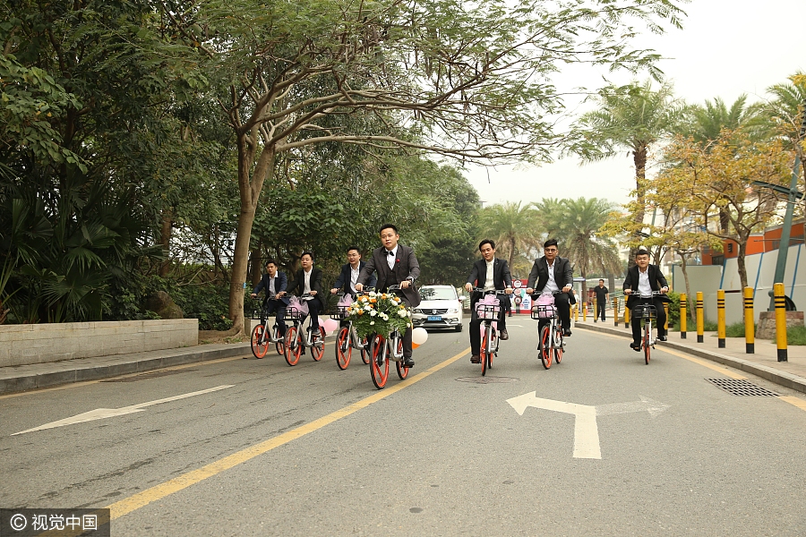 Sharing is caring: Newlyweds take bike-sharing ride