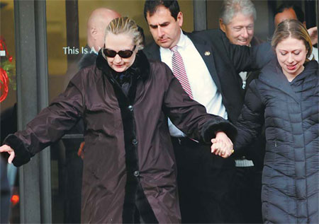 Clinton back home after treatment