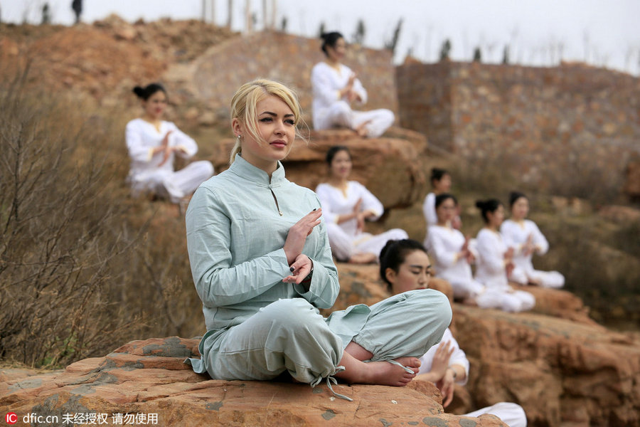 Danger! Women practice yoga on cliffs