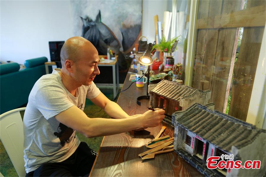 Nostalgic man makes building miniatures