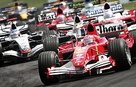 Ferrari Formula One driver Michael Schumacher of Germany leads the pack after the start of the Hungarian Grand Prix on Hungaroring near Budapest, July 31,2005. McLaren's Formula One driver Kimi Raikkonen of Finland won the race, Toyota Formula One driver Ralf Schumacher finished on third place.