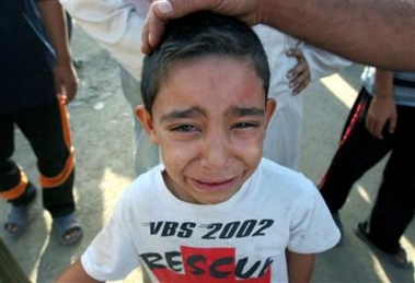 An Iraqi boy cries for his uncle who was killed in Baghdad's Sadr City, a Shiite slum in the eastern part of the capital, during overnight fighting in this Sunday Sept. 25, 2005 file photo.