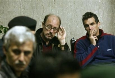 Dutch Hendrik Taatgen, centre, the school principal of the American International School in Beit Lahia, in northern Gaza, and his Australian deputy, Brian Ambrosio, right, are seen after their release inside the Gaza City office of Palestinian leader Mahmoud Abbas Wednesday, Dec. 21, 2005.