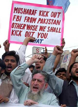 Protesters call for an end to the anti-al-Qaeda hunt