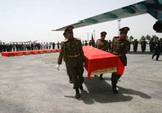 Bodies of slain workers brought home