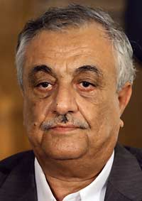 Saddam scoffs at charges of war crimes