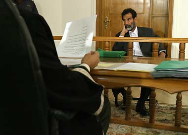 Saddam scoffs at charges of war crimes