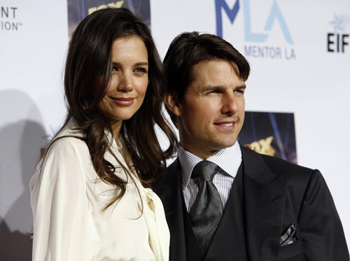 Tom Cruise and Katie Holmes pose at the Mentor LA's Promise gala in Los Angeles 