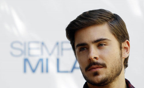 Zac Efron poses during a photocall to promote the film 'Charlie St. Cloud'