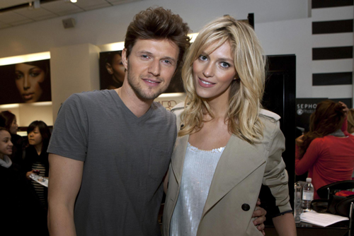Rubik signs a poster in Sephora store in Time Square