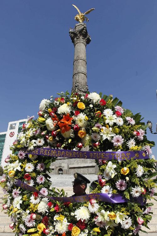 各地民眾紀(jì)念海地地震一周年