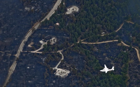 4 missing in US wildfire, homes burnt to ashes