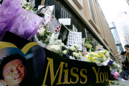 Fans of the late Hong Kong superstar Leslie Cheung place flowers outside the hotel, where Cheung committed suicide, in Hong Kong April 1, 2007, to mark the fourth anniversary of his suicide. Cheung, one of Asia's most enduring stars, died at the age of 46 and left behind a suicide note widely believed to have revealed emotional problems.