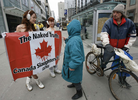 PETA members protest in Toronto and Bangkok