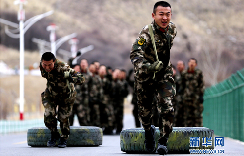 Popeye-like soldiers practice with tires