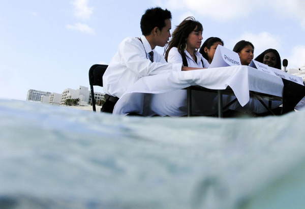 Environmental activists demonstrate in Cancun