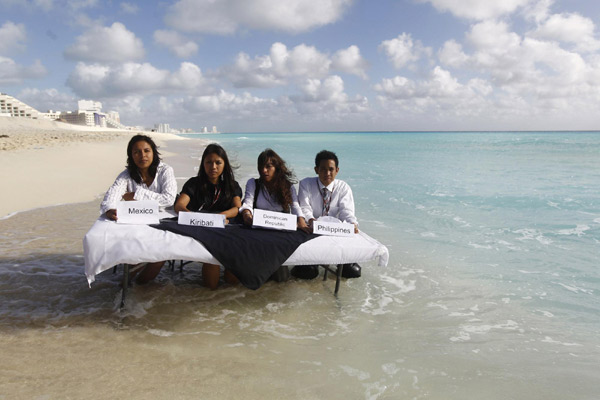 Environmental activists demonstrate in Cancun