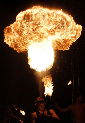 An artist performs during a fire show competition near the village of Ostroshitsky Gorodok, some 15 km (9 miles) north of the capital Minsk, Belarus early August 21, 2011. Dazzling fire show in Belarus