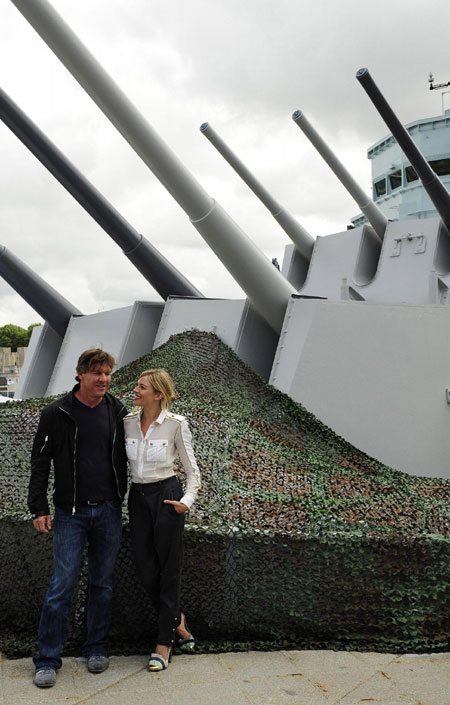 Sienna Miller poses for photographers during a photocall to promote 