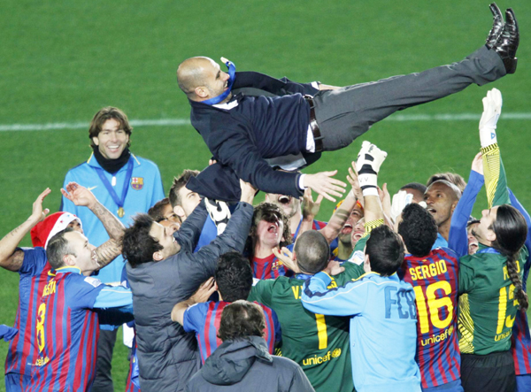 Lionel Messi scored two wonder goals as European champions Barcelona ripped apart Brazil's Santos 4-0 to win their second Club World Cup in swashbuckling style on Sunday. 'Invincible' Barca crush Santos to win Club World Cup