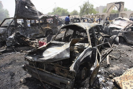 Waves of Baghdad blasts kill 97