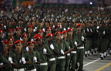 Hugs from Chavez as Gaddafi's Libya reaches 40