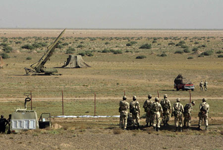 Under pressure for nukes, Iran test fires missiles