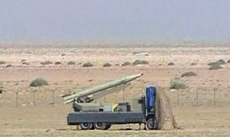 Under pressure for nukes, Iran test fires missiles
