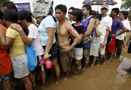 Philippine death toll rises, as new storms brew