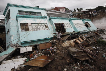 Philippine death toll rises, as new storms brew