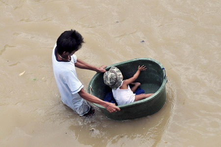 Philippine death toll rises, as new storms brew