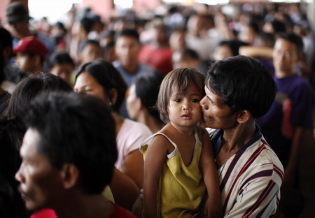 Philippine death toll rises, as new storms brew