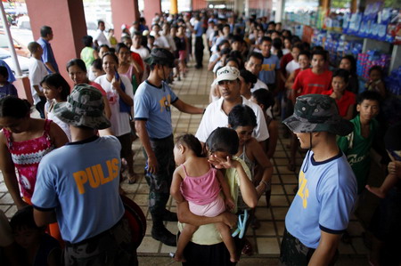 Philippine death toll rises, as new storms brew