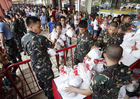 Philippine death toll rises, as new storms brew