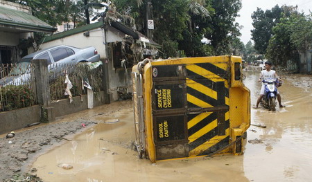 Philippine death toll rises, as new storms brew