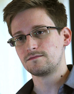 NSA whistleblower Edward Snowden is seen during an interview by The Guardian in his hotel room in Hong Kong in this June 6, 2013, file still image taken from video. Edward Snowden meets father in Russia
